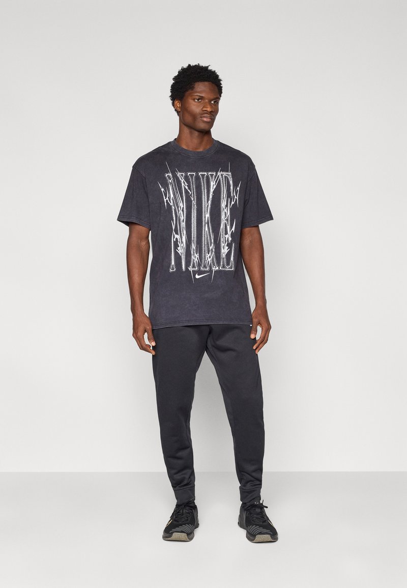 Nike Performance TEE TRAIN - Triko s potiskem - black