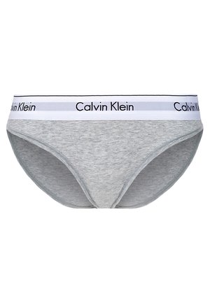 Grå bomulls bikiniundertøy med en hvit midjebånd som har svart "Calvin Klein" logo. Glatt tekstur, standard snitt design.