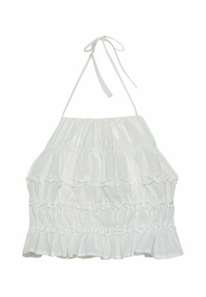 Haut halter blanc avec volants en couches, détails froncés et liens ajustables au cou, fabriqué en matériau léger.