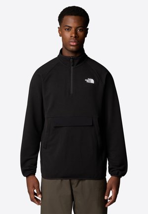 Felpa nera con mezza zip sul davanti, tessuto decorato, maniche lunghe e tasca frontale. Logo sul lato sinistro superiore.
