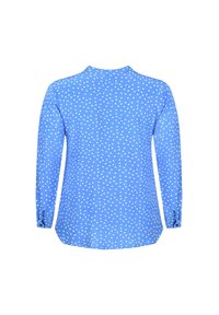 Långärmad blå blus med vita prickar, rund halsringning och knäppte manschetter. Slät tygkvalitet med en avslappnad passform och rak skärning.