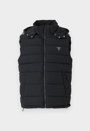 Black puffer vest with high collar, zippered front, and side pockets. Features quilted design and small triangular logo on the chest.