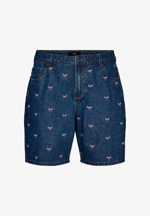 Tumesinisel riidel hallipraadivate eesnuppudega teksapüksid, taskud ja laiali laotatud väikesed roosad tikitud vibu mustrid.