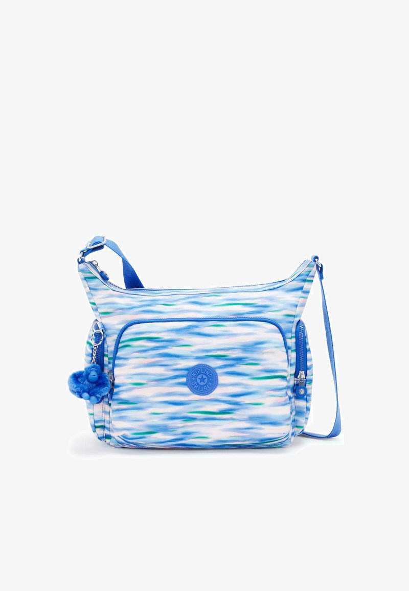 Blå mønstret crossbody taske lavet af holdbart materiale, med en lynlåslomme, justerbar strop og lille abe nøglering som accent.