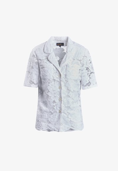 Lace blouse in light blue, featuring short sleeves, a collar, and a single chest pocket. Floral pattern throughout with button front closure.
