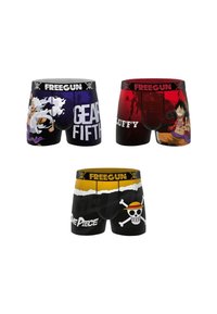 Trois paires de boxers colorés mettant en avant des personnages et logos de One Piece, avec des ceintures de marque Freegun.
