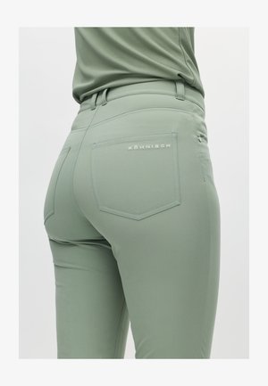 Hellgrüne, eng anliegende Hose mit glatter Textur. Verfügt über zwei Gesäßtaschen, dezente Logodetails und Gürtelschlaufen.