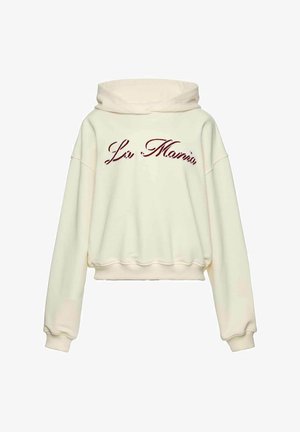 Kremowa krótka bluza z kapturem i sznurkiem, z bordowym, kursywnym napisem "La Moma" na przodzie oraz ściągaczami na mankietach i u dołu.