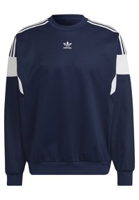 Mörkblå pullover-tröja med vita detaljer, ribbade muddar och fåll, med tre vita ränder på axlarna och en liten logotyp på bröstet.