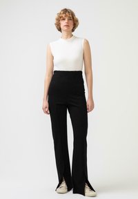 Touché Privé SLIT DETAILED - Hlače - black