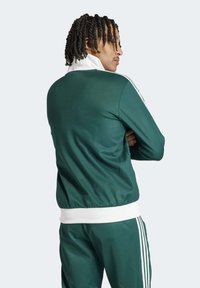adidas Originals Majica s kapuljačom i patentnim zatvaračem - collegiate green