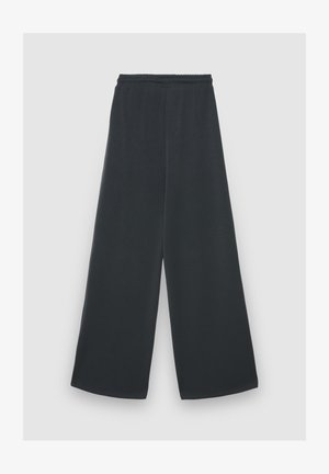 Schwarze, weit geschnittene Hose aus weichem Stoff, mit elastischem Bund und glatter Textur, in bodenlanger Ausführung.