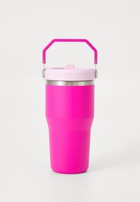 Pink insulated travel mug with a textured exterior, stainless steel rim, and a pink plastic handle, featuring a flip-top lid.