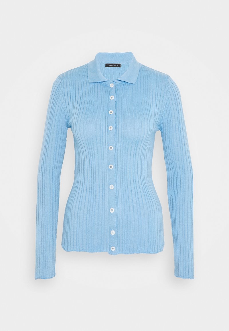 Light blue ribbed cardigan with long sleeves, button-up front, and a collar. Fabric appears soft with a smooth texture and detailed stitching.