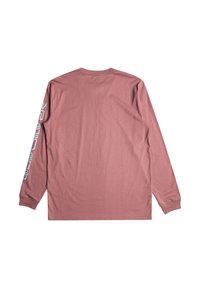 Långärmad skjorta i dammig rosafärg, tillverkad av mjuk bomull. Har en rundad halsringning och ett grafiskt tryck längs vänster ärm.