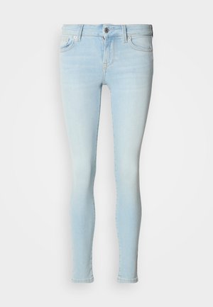 Heledast sinised kitsad teksad, valmistatud denimist, milles on viis taskut, nööbi- ja tõmblukuga sulgemine ning ühtlane kulunud tekstuur.