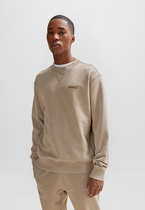 Felpa beige con polsini e orlo a costine, caratterizzata da un collo a giro e un sottile logo "BOSS" in tessuto abbinato. Texture liscia, vestibilità comoda.