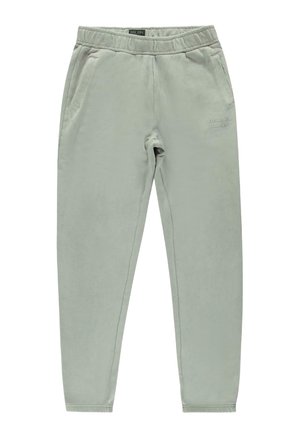 Lichtgrijze sweatpants met een elastische tailleband, twee zijzakken en subtiele tekstdetails "Create Your Stories". Zachte gomtextuur.