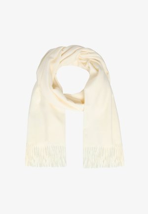 Krém színű, puha sál, rojtos végekkel, lazán hurkolva egy fehér háttér előtt.