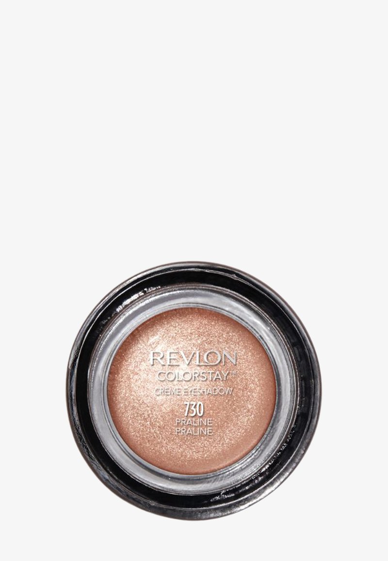 Revlon Colorstay crème eyeshadow en Praline, une teinte bronze clair et ronde avec une finition scintillante dans un contenant noir transparent.