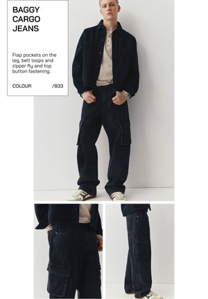 Person trägt schwarze, weite Cargo-Jeans mit Klappentaschen, Gürtelschlaufen, Reißverschluss und eine schwarze Jacke über einem beigen Hemd.