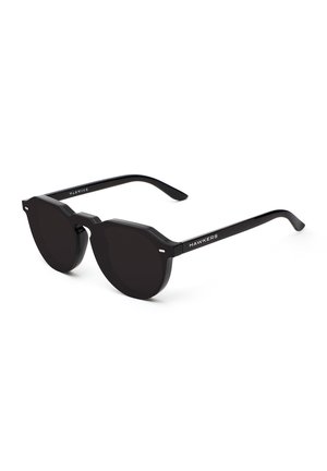 Black octagonal sunglasses with dark lenses. The frame is made of matte plastic, with a silver accent on the temples featuring the brand name "HAWKERS."