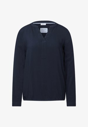T-shirt à manches longues bleu marine avec un décolleté en V, en tissu texturé et avec un ourlet élastiqué. Présente un petit plastron et des poignets au niveau des poignets.