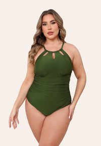 Costume intero verde con scollo all'americana, dettagli con tagli e lati arricciati. Tessuto liscio e elastico adatto per l'abbigliamento da nuoto.