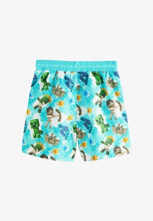 Pantaloni de înot de culoare albastră deschisă, cu un model pixelat al personajelor dintr-un joc. Talie elastică, material ușor și grafica colorată.