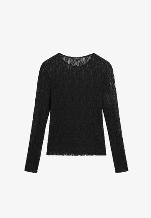 Top nero a maniche lunghe realizzato in tessuto di pizzo strutturato. Presenta una scollatura rotonda e una silhouette aderente con un orlo leggermente corto.
