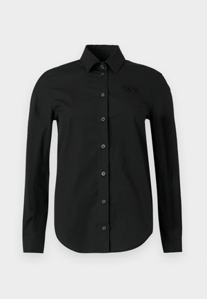 Camisa preta de manga comprida com colarinho, design com botões na parte da frente, textura lisa e um logótipo discreto no peito.