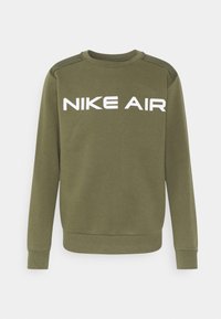 Olivově zelená mikina s dlouhými rukávy, kulatým výstřihem a bílým logem "NIKE AIR" na hrudi. Měkká tkanina s ribovanými manžetami a zakončením.