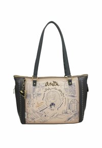 Sac fourre-tout en matériau synthétique beige et noir avec des dessins artistiques. Il est doté de bretelles doubles et de décorations en métal doré.