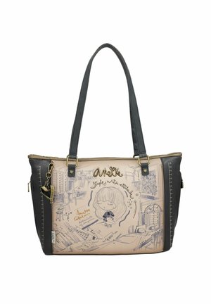 Tote-Bag aus beigem und schwarzem synthetischem Material mit künstlerischen Zeichnungen. Verfügt über zwei Schultertragegurte und Akzente aus goldfarbenem Metall.