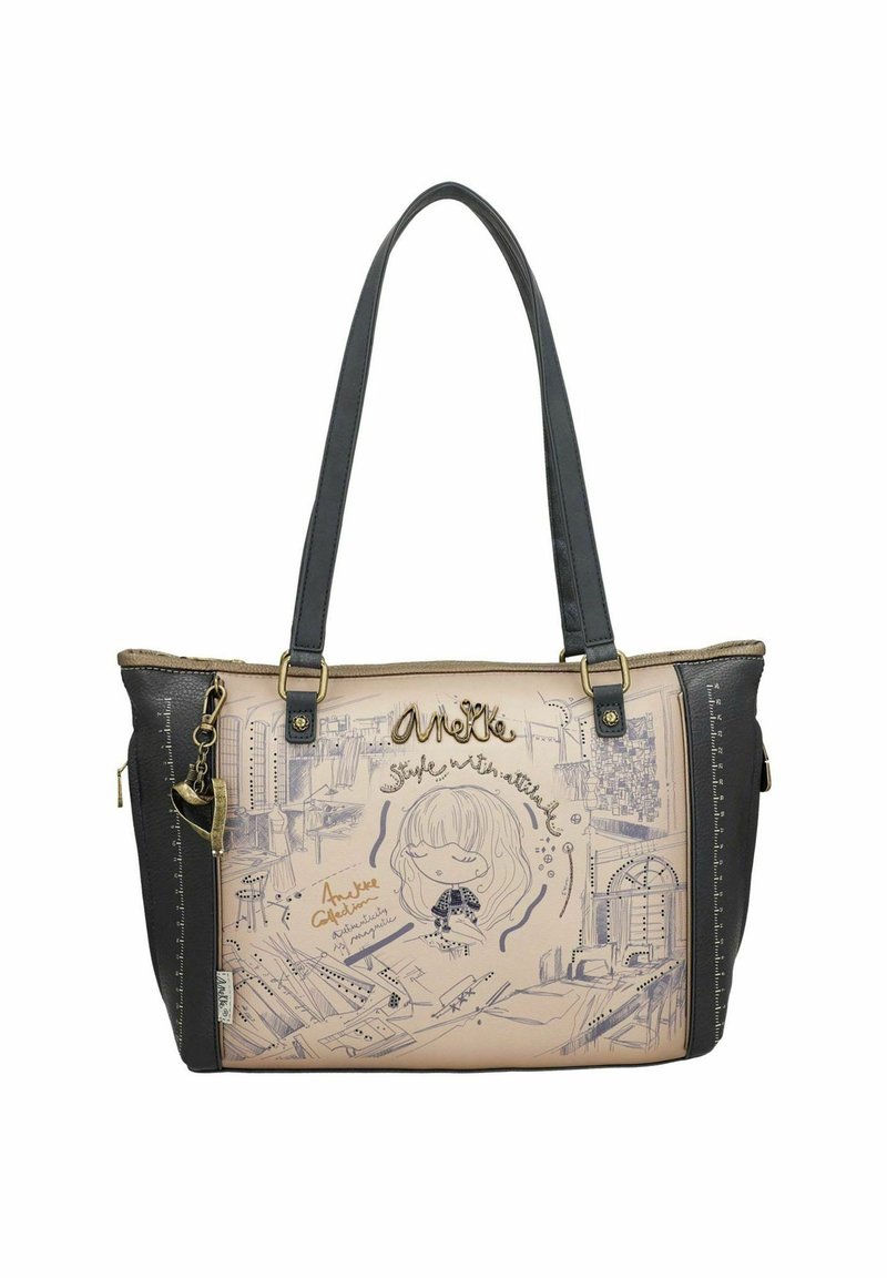 Sac fourre-tout en matériau synthétique beige et noir avec des dessins artistiques. Il est doté de bretelles doubles et de décorations en métal doré.