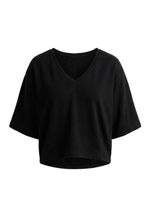 Top corto negro de manga corta con cuello en V, de ajuste holgado y dobladillo ligeramente curvado, mostrado sobre un fondo blanco.