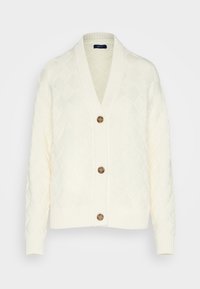 Vit stickad cardigan med diamantmönster, sjalkrage, fem knappar samt ribbade manschetter och nederkant. Mjuk textur, avslappnad passform.