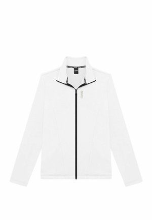 Balts zip-up jakas ar melniem akcentiem un stāvīgu apkakli. Iezīmē minimālistisku dizainu, ar zelta krāsā izšūtu zīmola nosaukumu priekšpusē.