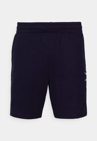 Shorts bleu marine en tissu respirant, dotés d'une taille élastique et d'un petit logo blanc sur le côté gauche. Design décontracté.