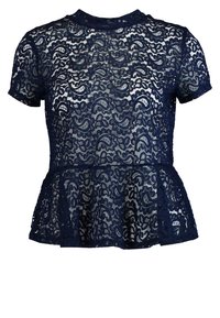 Marinblå spets-peplumtop med korta ärmar och blommönster. Tyget har en genomskinlig textur och vågiga kanter.