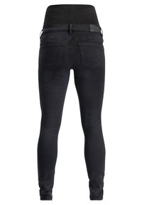 Jean skinny en denim noir avec une texture lisse, taille mi-haute et poches arrière standard. Présente un design sans couture sans matériel visible.