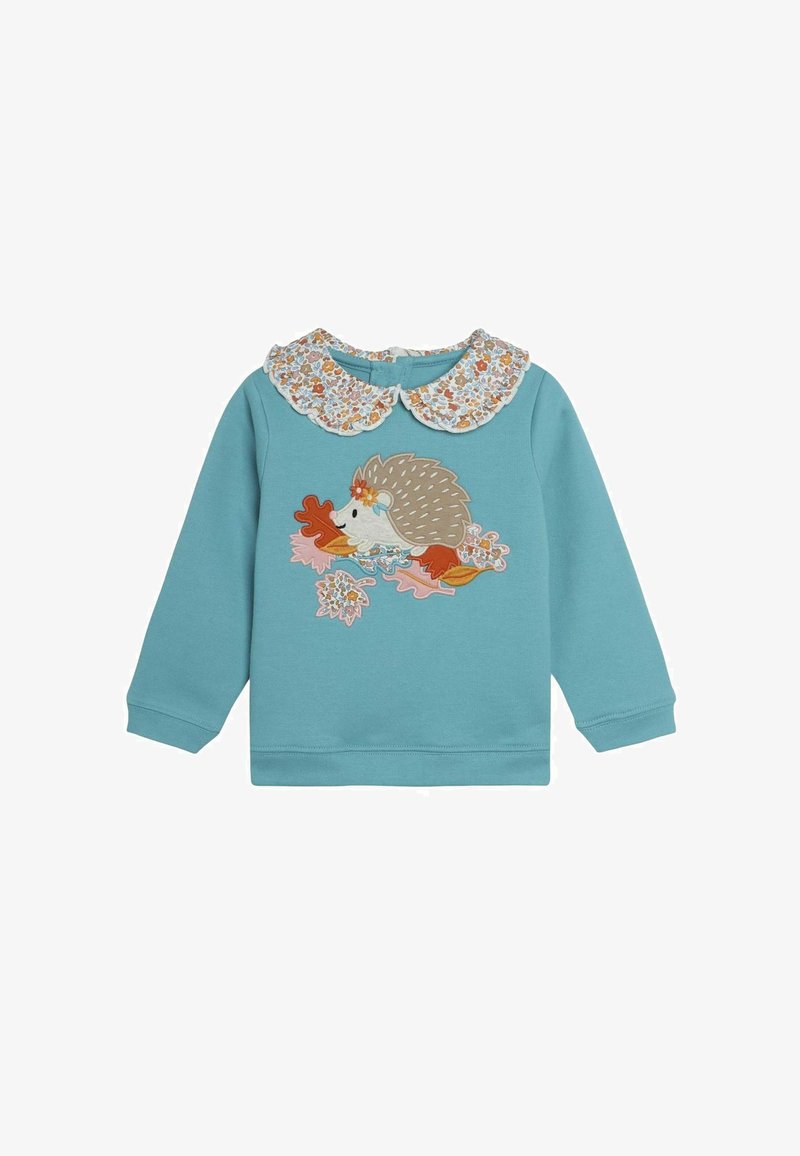 Felpa blu con colletto floreale bianco, caratterizzata da un ricamo di un riccio con foglie e fiori. Maniche lunghe e una texture morbida.