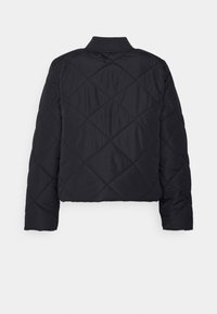 Black, quilted jacket with a cropped design, featuring a ribbed collar and long sleeves, displaying a diagonal pattern across the fabric.