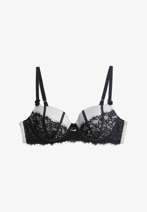 Schwarzer Spitzen-BH mit Unterdraht und abnehmbaren Trägern, mit einer floralen Spitzenüberlage, einem glatten Stoffbasis und einer dekorativen Mittel-Schleife.