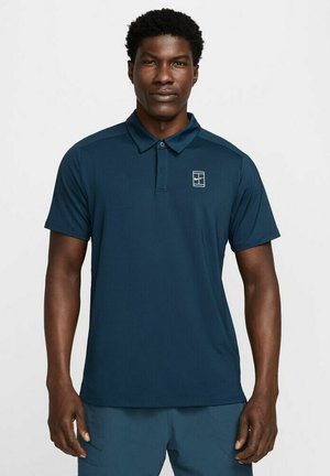 Navy blue polo shirt made of smooth, breathable fabric; features a two-button placket and a small logo on the upper left chest.