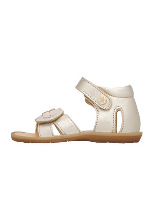 Sandalo per bambini color crema con suola morbida, cinturino alla caviglia e fiore decorativo sulla cinghia frontale, progettato per comfort e aderenza sicura.
