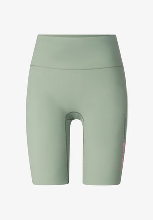 Lichtgroene, hoog getailleerde fietsshorts met platte naden en kleine roze tekst "RINE ICE" op de rechterdij.