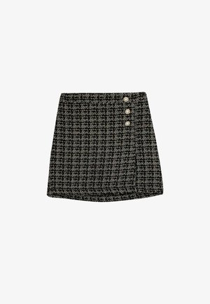 Jupe à carreaux noir et blanc en tissu texturé, dotée de trois boutons décoratifs sur le côté gauche et d'une coupe droite.