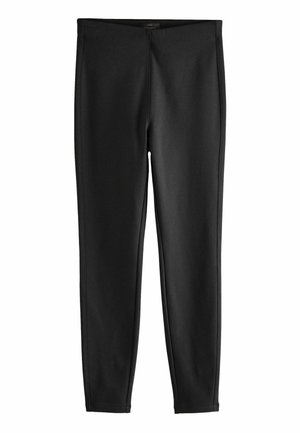 Fekete leggings sima, rugalmas anyagból, testhezsimuló kialakítással, látható varrások vagy minták nélkül. Bokáig érő fazon.