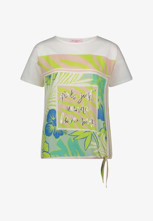 T-shirt blanc à manches courtes avec imprimé floral tropical, rayures vert néon et texte « girls just wanna have fun » en écriture argentée.